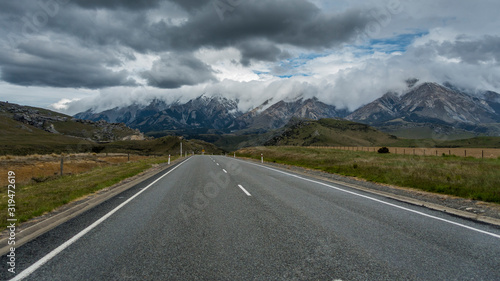 Asphalt road heading into a mountains
