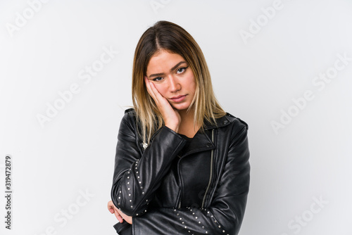 Young caucasian woman wearing a black leather jacket who is bored, fatigued and need a relax day.