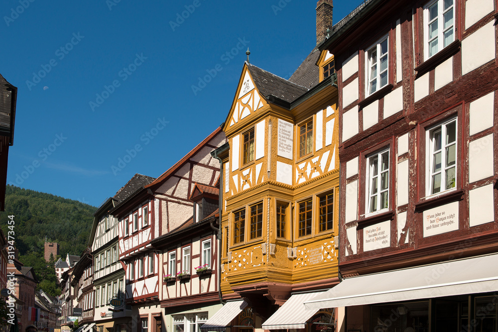 Miltenberg, Germany - July 24, 2019; City view with half timbered houses on a blue sky in the city of Miltenberg a touristic town on the romantic road in Bavaria