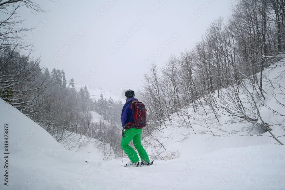 Freerider on the snow-covered slopes of a ski resort, Sochi, Russia.
