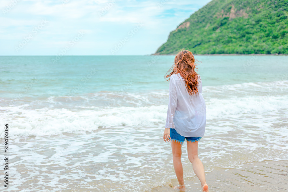 Young woman running playful on tropical beach in freedom. Young woman running playful on tropical beach in freedom.