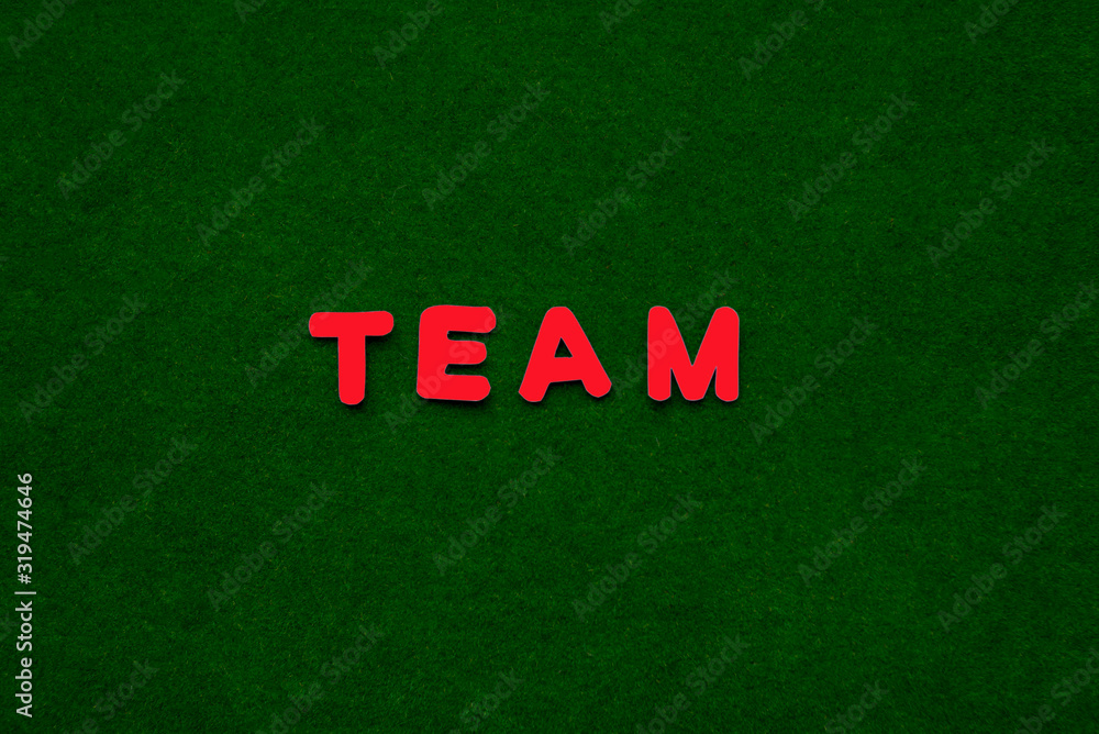 team on a green background. Word, red letters. team on a green background. Word, red letters.