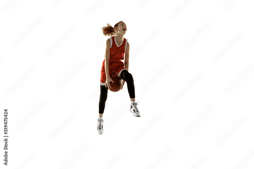 Young caucasian female basketball player in action, motion in jump isolated on white background. Redhair sportive girl. Concept of sport, movement, energy and dynamic, healthy lifestyle. Training. Young caucasian female basketball player in action, motion in jump isolated on white background. Redhair sportive girl. Concept of sport, movement, energy and dynamic, healthy lifestyle. Training.