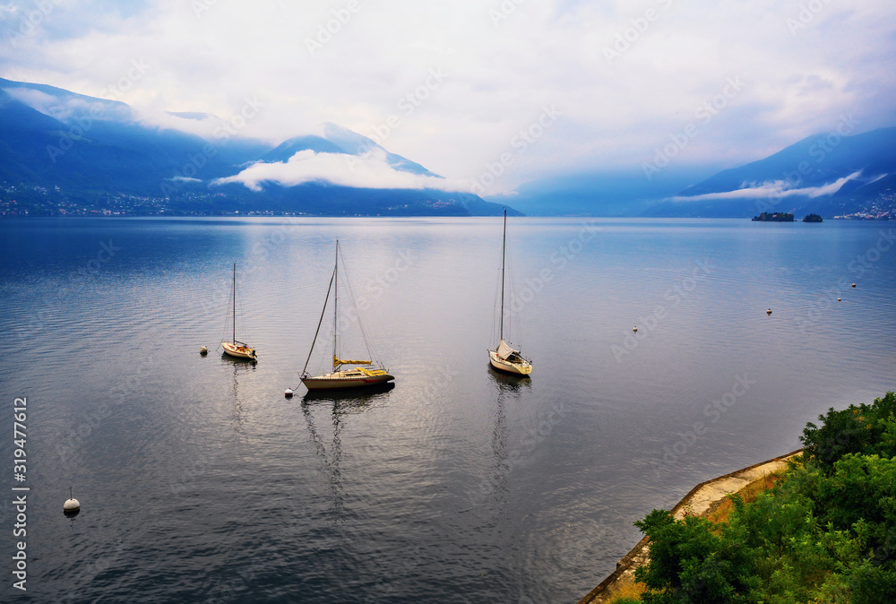 Lake Maggiore, boats and Alps from Ascona.