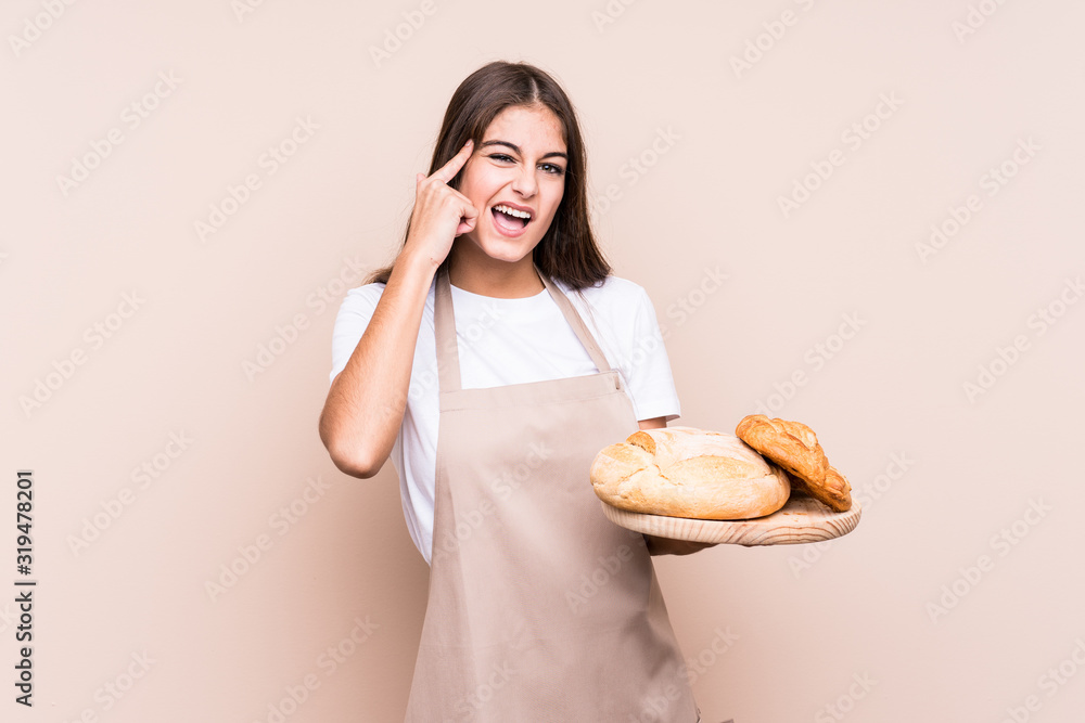Young caucasian baker woman isolated showing a disappointment gesture with forefinger. Young caucasian baker woman isolated showing a disappointment gesture with forefinger.