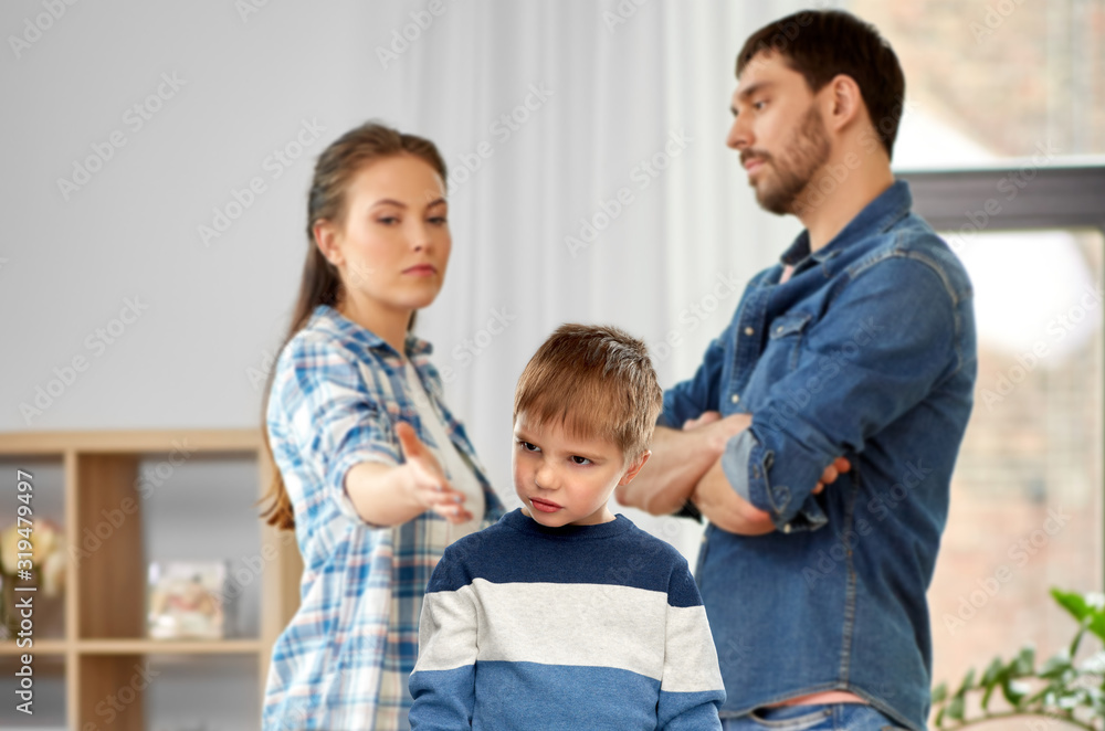family, problem and people concept - unhappy sad little boy over arguing mother and father over home background family, problem and people concept - unhappy sad little boy over arguing mother and father over home background