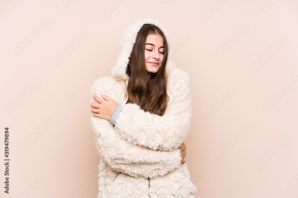 Young caucasian woman posing isolated hugs, smiling carefree and happy. Young caucasian woman posing isolated hugs, smiling carefree and happy.