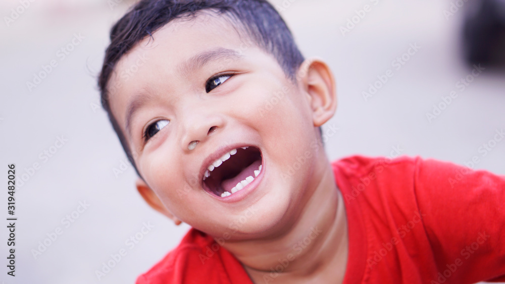 Portrait of cute happy boy close-up of smiley face. Little kid 2 year old show his white tooth. Portrait of cute happy boy close-up of smiley face. Little kid 2 year old show his white tooth.