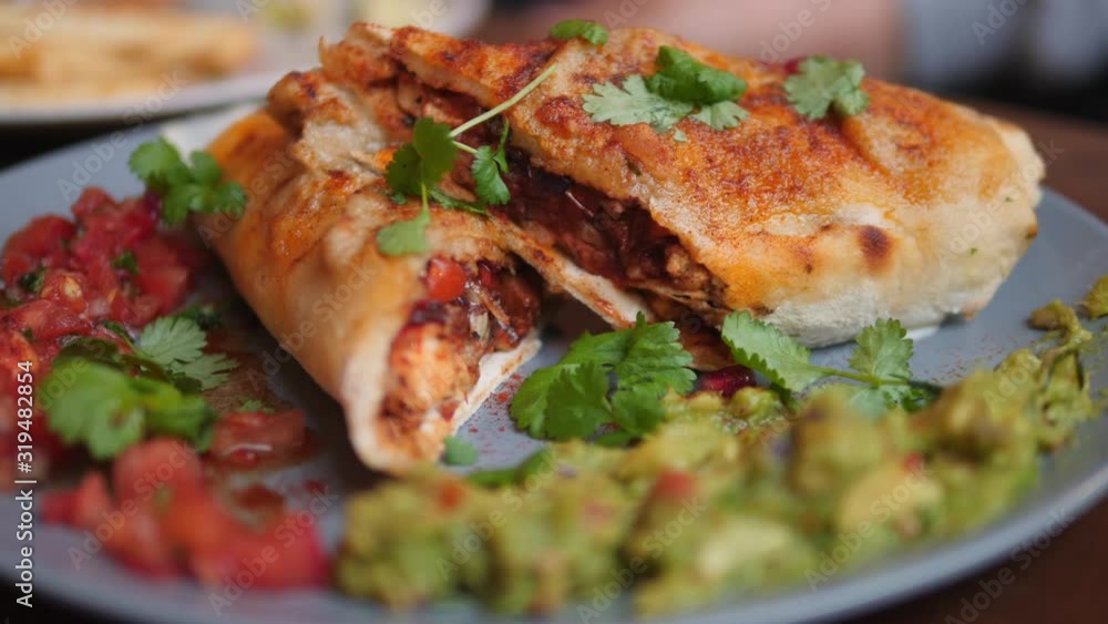 Closeup On Vegan Wrap With Avocado And Salsa. Healthy Eating Concept. Closeup On Vegan Wrap With Avocado And Salsa. Healthy Eating Concept.