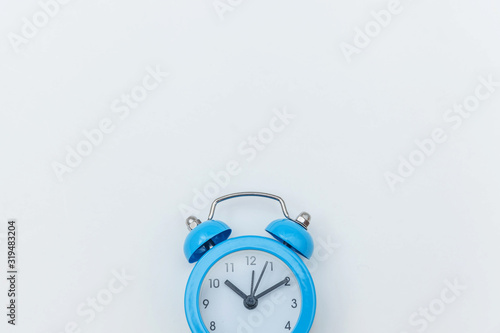 Simply flat lay design Ringing twin bell vintage classic alarm clock Isolated on white background. Rest hours time of life good morning night wake up awake concept. Flat lay top view copy space.
