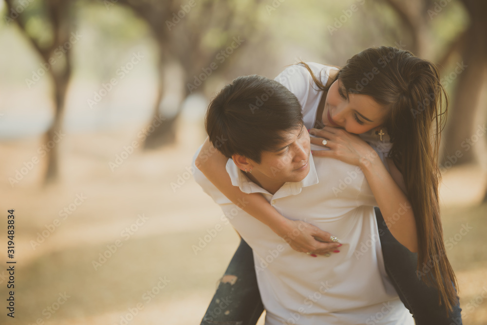 Portrait of young asian couple in love in the forest,Thailand people happy to be together,Valentine day concept Portrait of young asian couple in love in the forest,Thailand people happy to be together,Valentine day concept