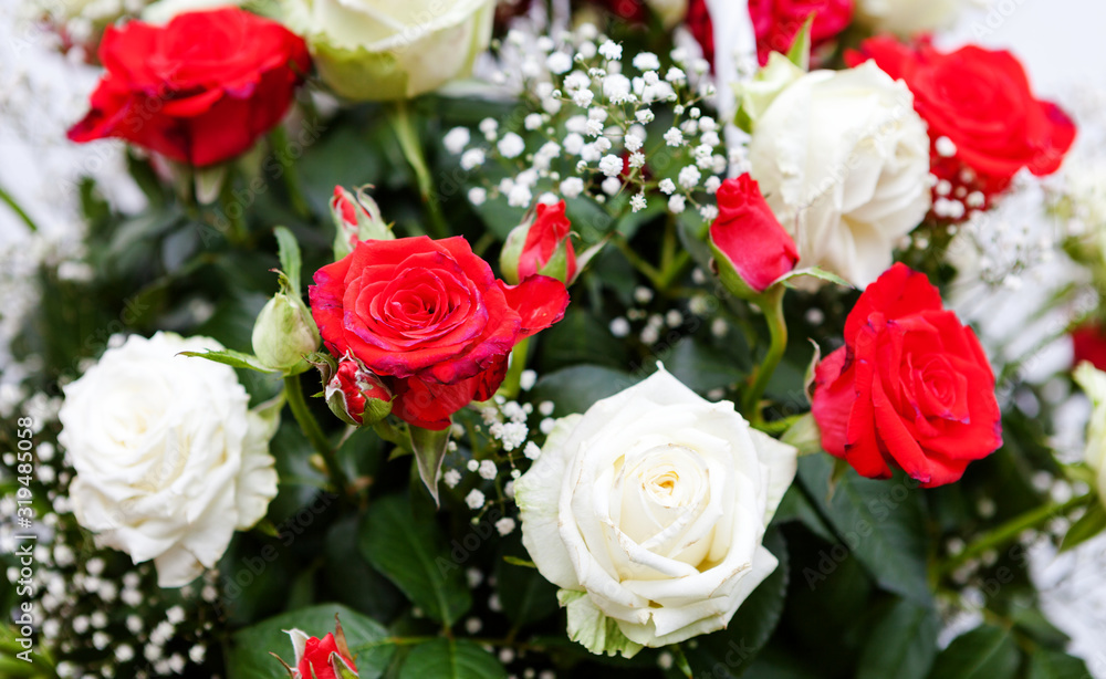 Bouquet of red and white roses. The gift for a woman for Valentine's Day. Bouquet of red and white roses. The gift for a woman for Valentine's Day.