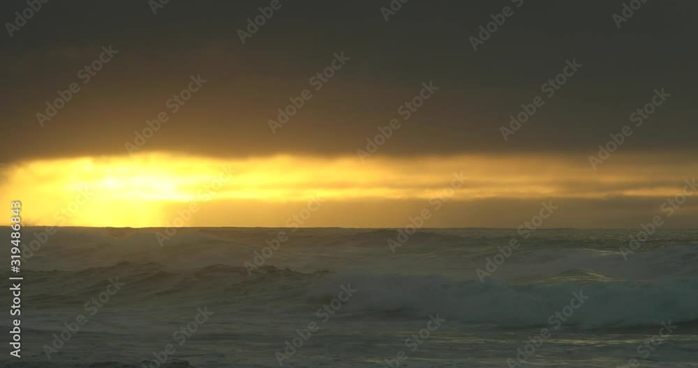 Sunset on beach in Oahu, Hawaii.