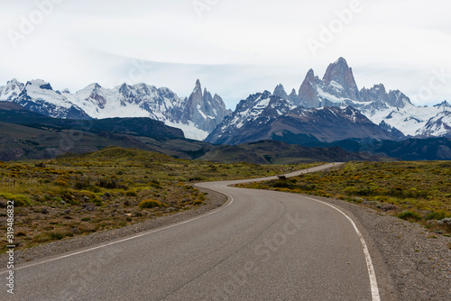 Empty road with the Mount Fitz Roy on the background. Patagonia, Argentina