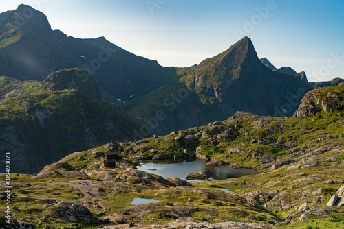 Northern Norway Landscape View of Beautiful mountain tops and reflecting lakes in Munkebu Huts Lofoten Islands at summer times. 