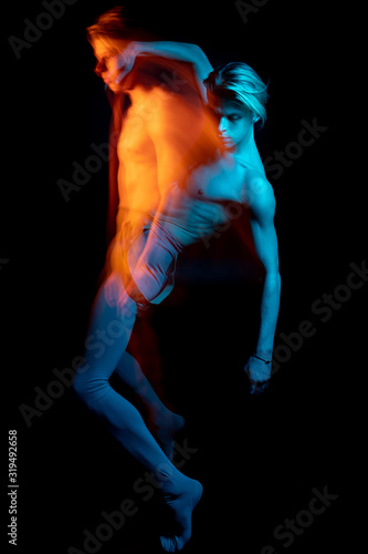 Double portrait of falling handsome torso naked man. Blue and orange. dancer choreographer allegorical metaphorical representation emotions and feelings