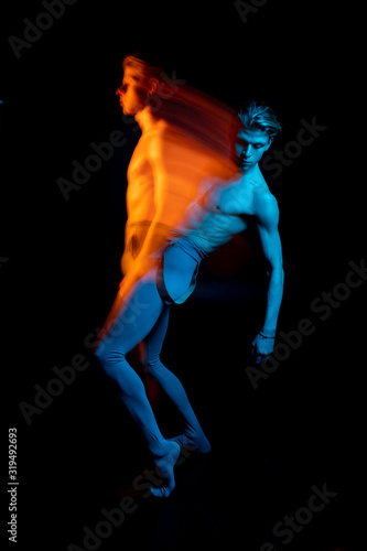 Dancing Double portrait of falling handsome torso naked man. Blue and orange. dancer choreographer allegorical metaphorical representation emotions and feelings