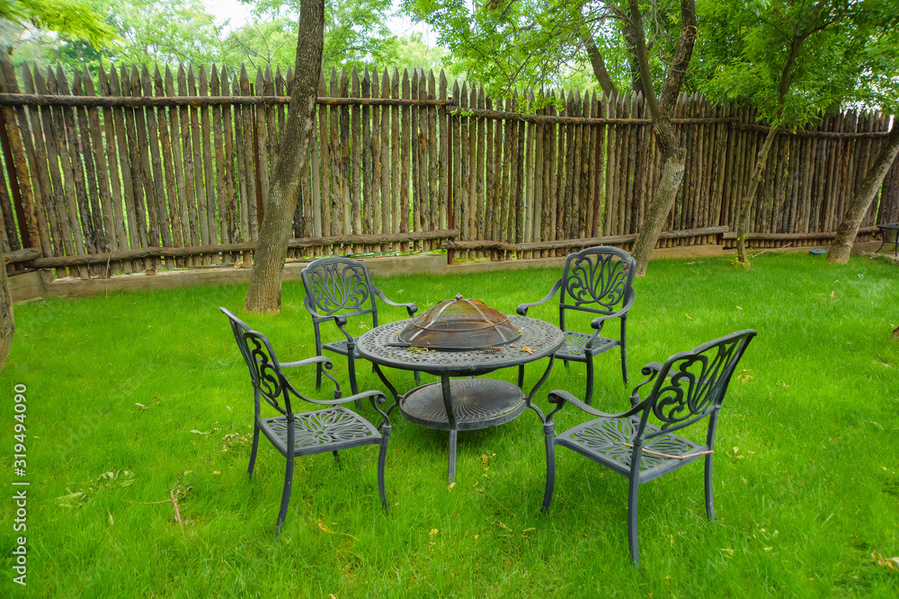 Garden furniture with builtin barbecue hearth fireplace in the table