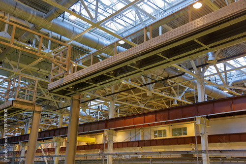 The combination of the steel beams and metal pipes in the industrial premise of the plant © ironstuffy