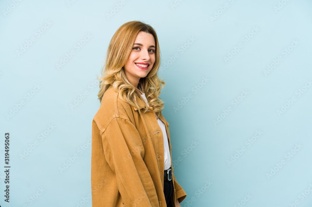 Young blonde pretty woman isolated looks aside smiling, cheerful and pleasant. Young blonde pretty woman isolated looks aside smiling, cheerful and pleasant.