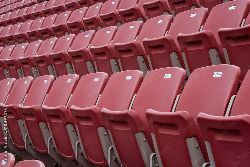 Naklejka premium Rows of red empty seats in stadium