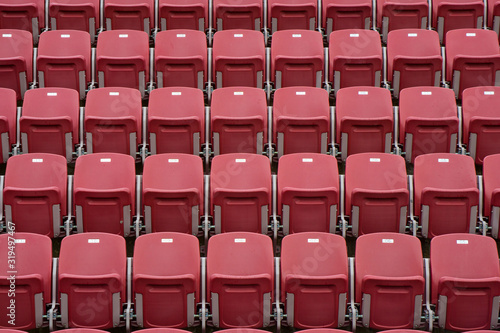 Rows of red empty seats in stadium