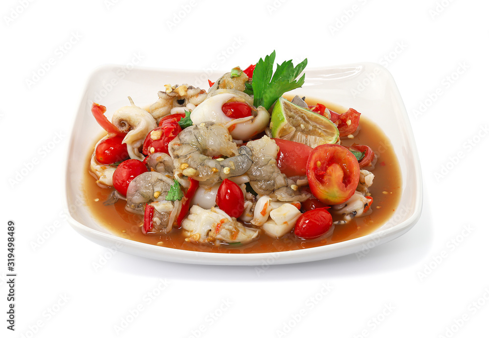 Thai Style spicy seafood salad with shrimps isolated on the white background with clipping path. Thai Style spicy seafood salad with shrimps isolated on the white background with clipping path.