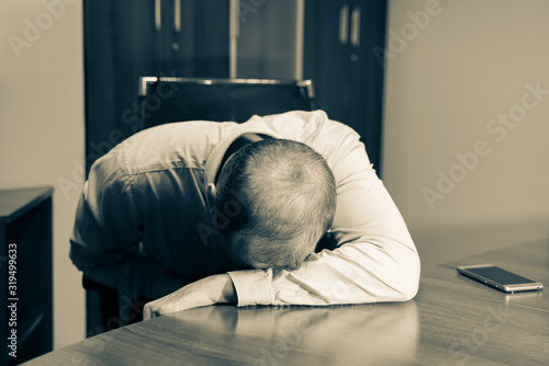 Photos Middle aged man is depressed and exhausted