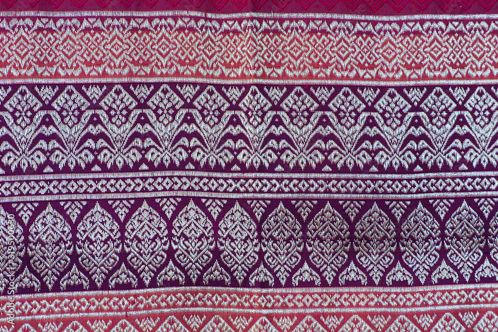 The image of the red Thai silk pattern that is woven in Thailand.