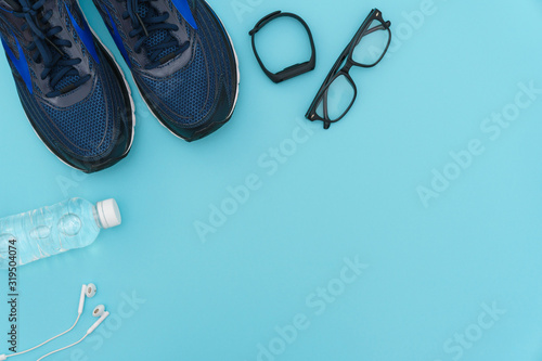 fitness stuffs against aqua background. health care conceptual images. flat lay. copy space