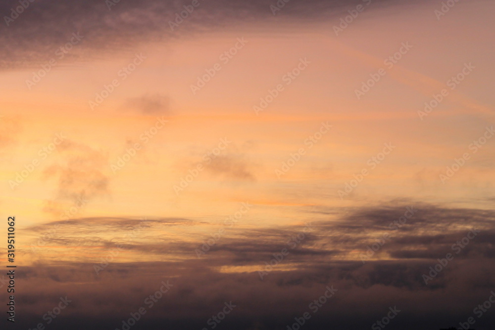 A beautifully backlit colorful sunset sky with the colors of sunrise and sunset. A beautifully backlit colorful sunset sky with the colors of sunrise and sunset.