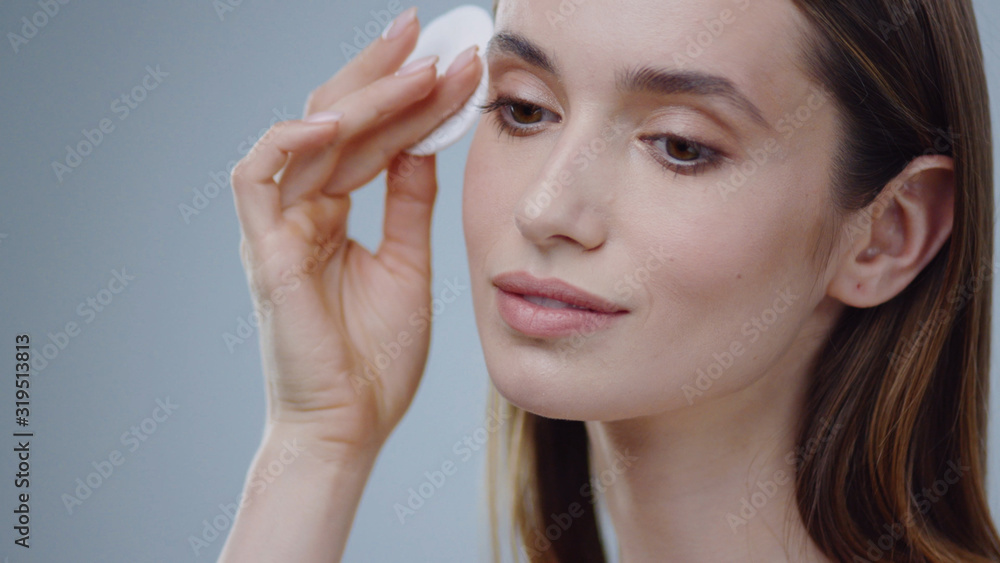 Young brunette woman using cotton pads removing makeup skin care concept clean female makeup portrait beautiful cosmetic foundation health smile beauty perfect care closeup Young brunette woman using cotton pads removing makeup skin care concept clean female makeup portrait beautiful cosmetic foundation health smile beauty perfect care closeup