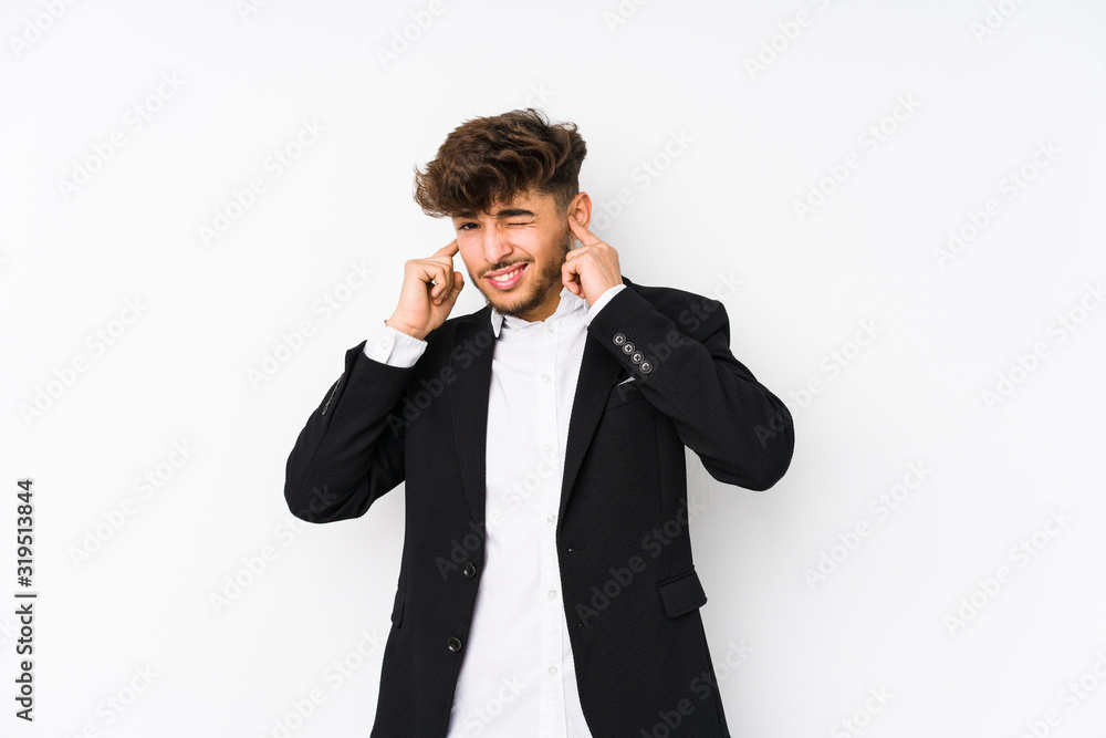 Young arabian business man isolated covering ears with hands. Young arabian business man isolated covering ears with hands.