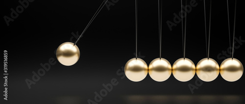 gold-colored newton pendulum on a black background.