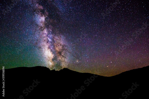 The Milky Way is illuminated over Wheeler Peak at night in Great Basin National Park, Nevada. photo