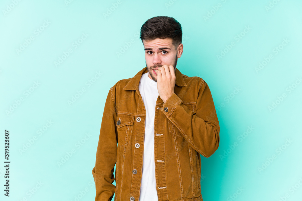 Young handsome man biting fingernails, nervous and very anxious. Young handsome man biting fingernails, nervous and very anxious.