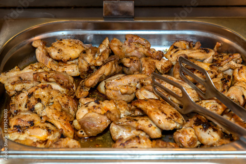 Roasted chicken seasoned slices over a tray