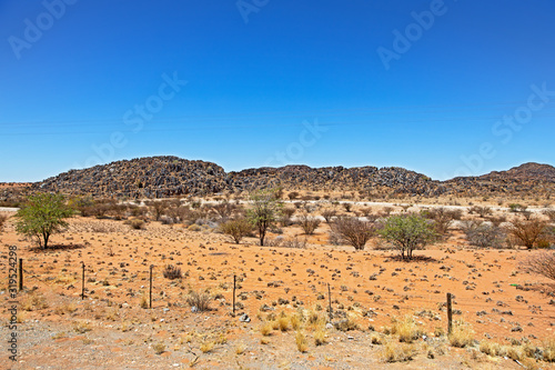 Black volcanic hills in barren Northern Cape photo