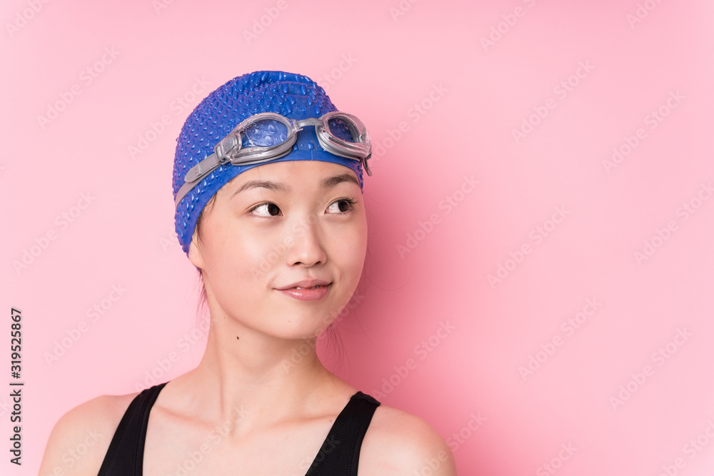 Young japanese swimmer woman face closeup isolated Young japanese swimmer woman face closeup isolated