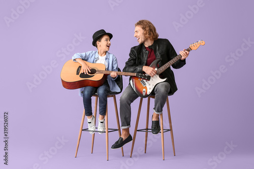 Man and his little son play...