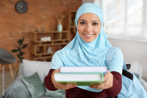Female Muslim student at home