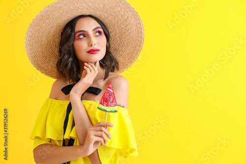 Young woman in straw hat an...