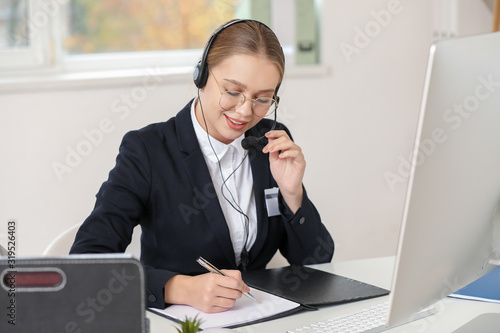 Female secretary working in...
