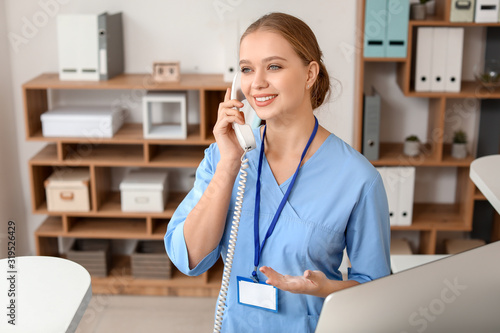 Young female receptionist t...
