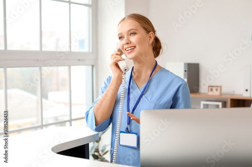 Young female receptionist t...