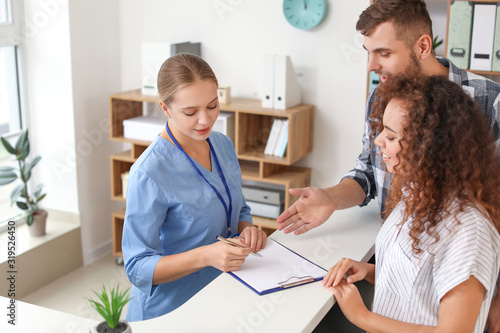 Young female receptionist w...