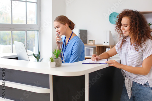 Young female receptionist t...