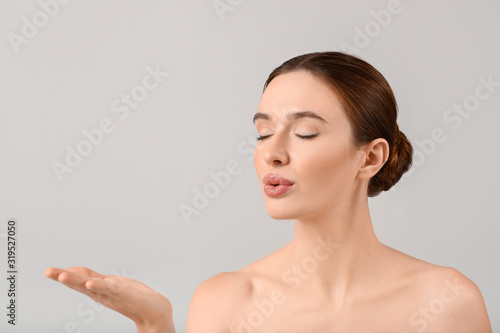Beautiful young woman with ...