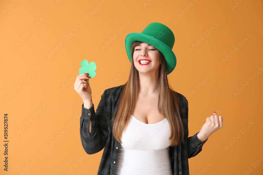 Funny young woman with paper clover on color background. St. Patrick's Day celebration Funny young woman with paper clover on color background. St. Patrick's Day celebration