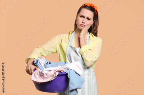 Tired young housewife with ...